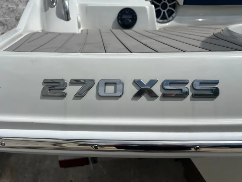 Slide: The Image of 2024 Crownline 270 XSS boat model emblem on deck. - 23