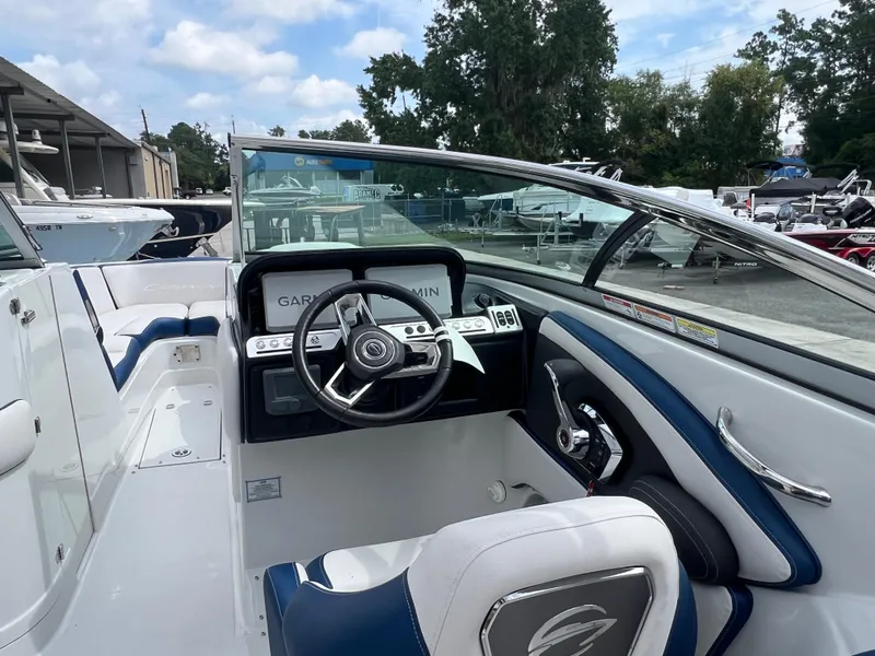 Slide: The Image of 2024 Crownline 270 XSS boat interior with steering wheel and dashboard. - 3