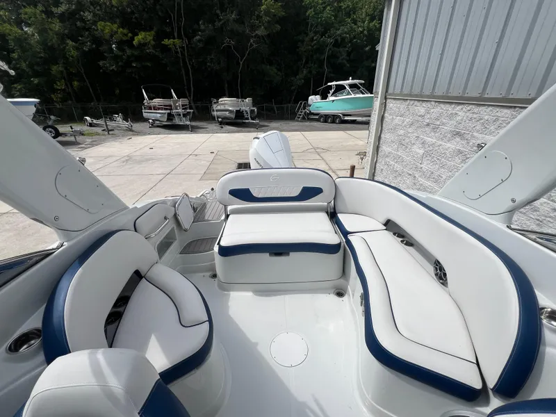Slide: The Image of 2024 Crownline 270 XSS boat interior with white and blue seating. - 4