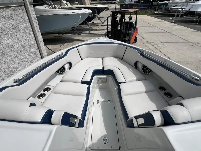 Slide: The Image of 2024 Crownline 270 XSS boat with spacious white and blue seating area. - 5