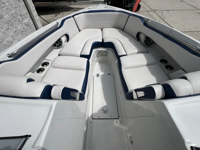 Slide: The Image of 2024 Crownline 270 XSS boat interior with white and blue cushioned seating. - 7