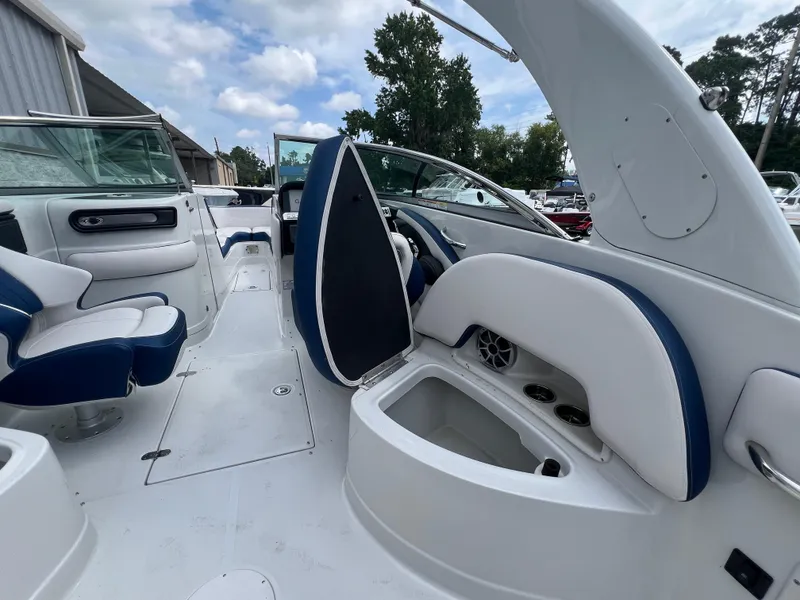 Slide: The Image of 2024 Crownline 270 XSS boat interior with white and blue seating. - 8