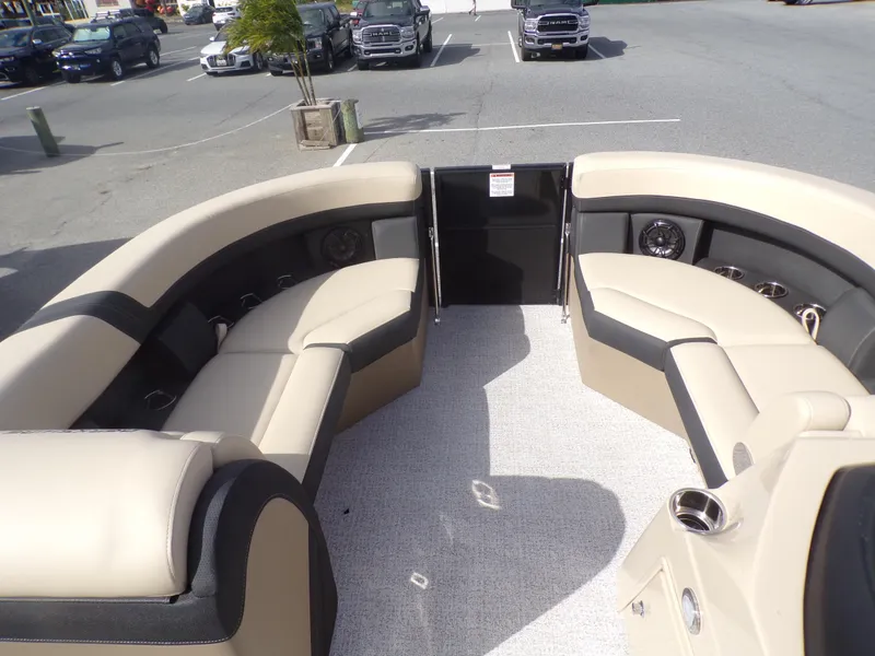 Slide: The Image of 2024 Berkshire 22RFX CTS pontoon boat with black canopy and Mercury engine. - 6