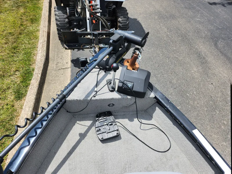 Slide: The Image of 2013 Tracker Super Guide V-16 SC boat with trolling motor and fish finder. - 16