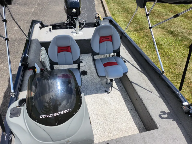 Slide: The Image of 2013 Tracker Super Guide V-16 SC boat interior with seating and console. - 18