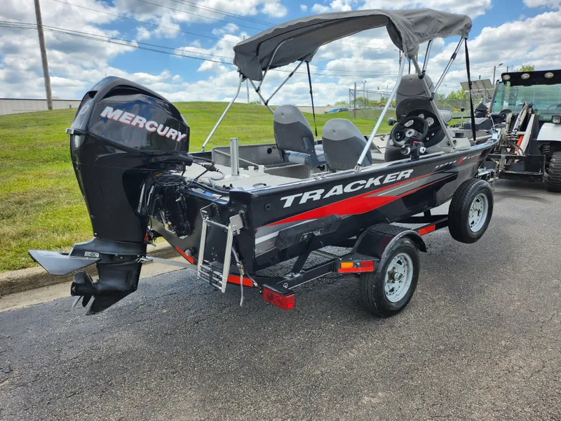Slide: The Image of 2013 Tracker Super Guide V-16 SC boat with Mercury outboard motor on trailer. - 3