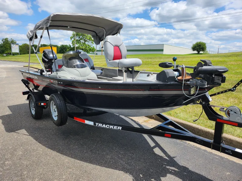 Slide: The Image of 2013 Tracker Super Guide V-16 SC fishing boat on trailer with canopy. - 5