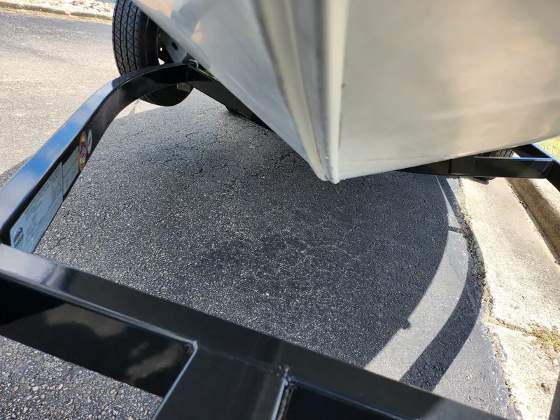 Slide: The Image of 2013 Tracker Super Guide V-16 SC boat on trailer, close-up view. - 7