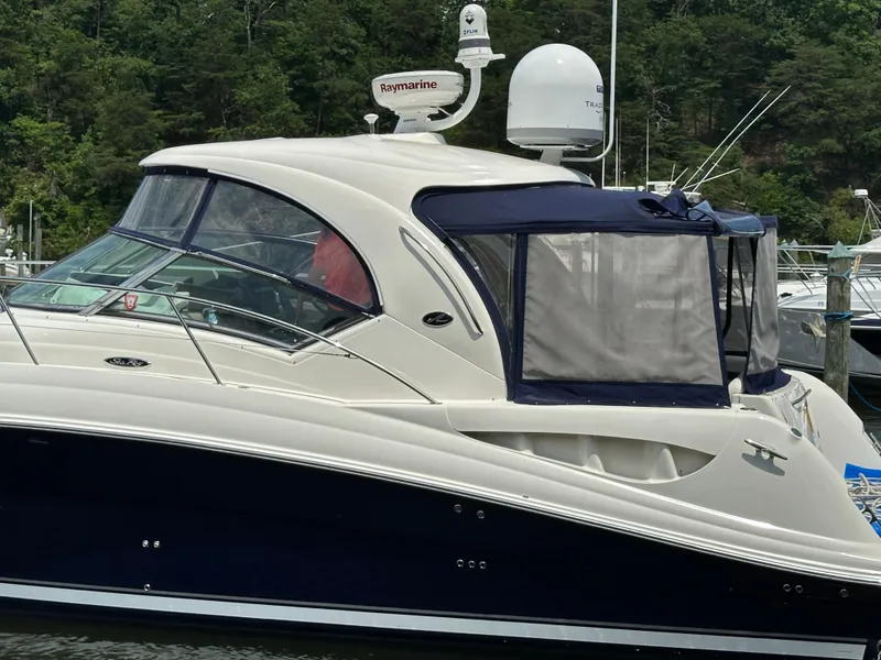 Slide: The Image of 2004 Sea Ray 390 Sundancer yacht docked, side view with Raymarine radar. - 12