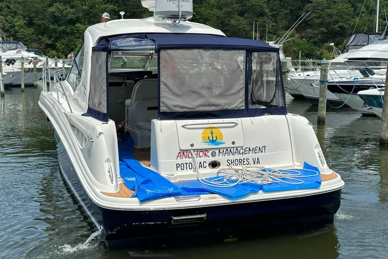 Slide: The Image of 2004 Sea Ray 390 Sundancer yacht docked at marina, named Anchor Management. - 18