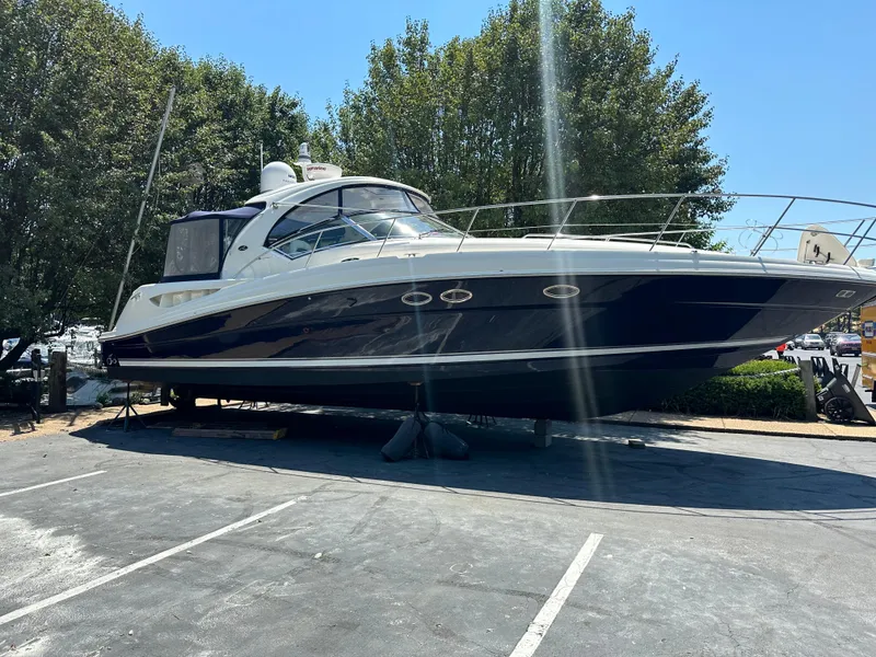 Slide: The Image of 2004 Sea Ray 390 Sundancer yacht on dry dock, side view. - 7