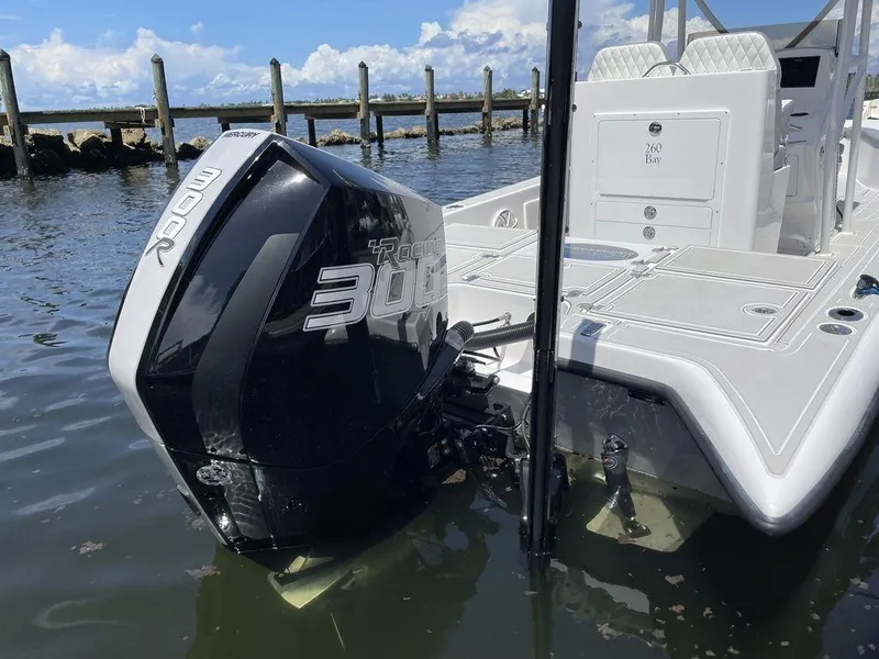 Slide: The Image of 2023 Velocity 26 BAY HYBRID boat with a powerful 300 HP engine in the water. - 15