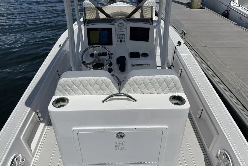 Slide: The Image of 2023 Velocity 26 BAY HYBRID boat interior with steering console and seating. - 18
