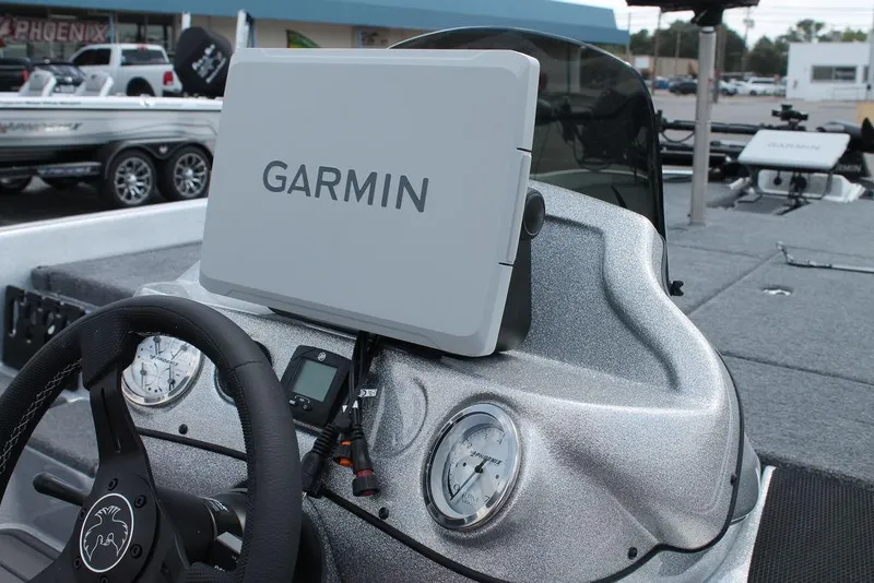 Slide: The Image of 2025 Phoenix 921 ELITE boat dashboard with Garmin navigation system. - 7