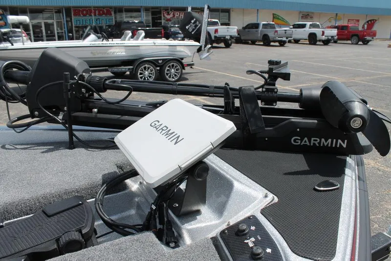 Slide: The Image of 2025 Phoenix 921 ELITE boat with Garmin navigation system and trolling motor. - 9