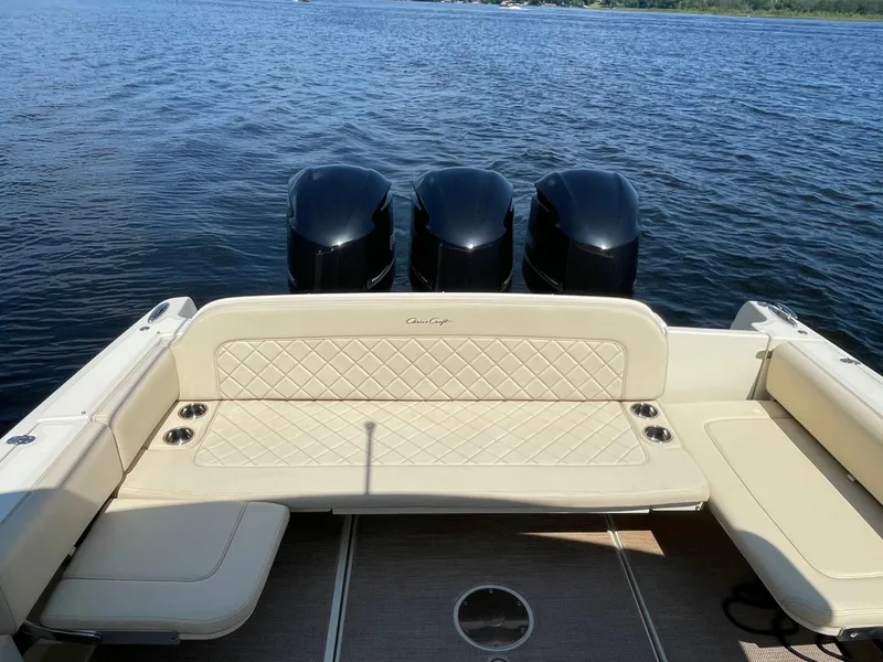 Slide: The Image of 2019 Chris-Craft Catalina 34 boat with triple outboard engines on water. - 10