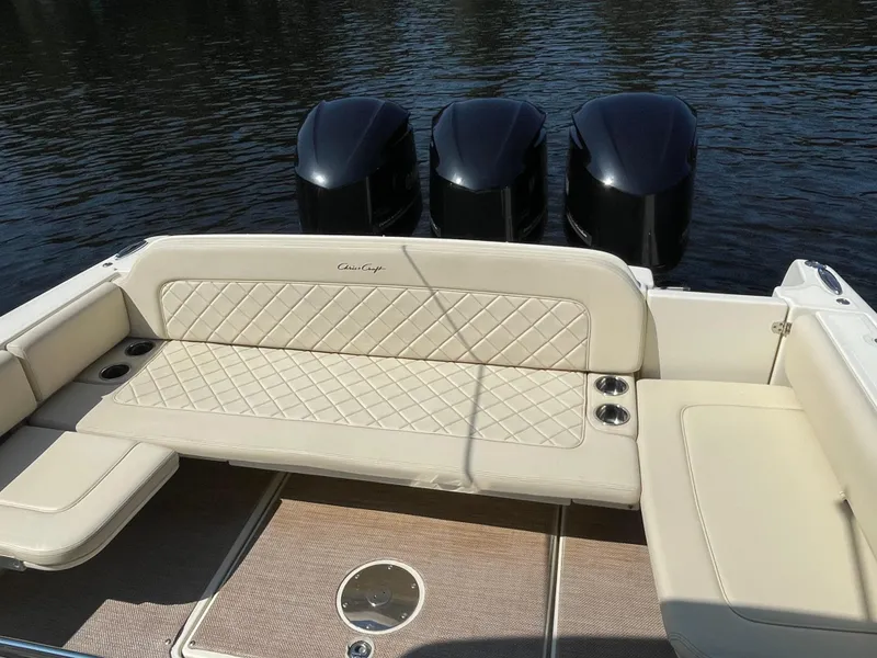Slide: The Image of 2019 Chris-Craft Catalina 34 boat with triple outboard engines and beige seating. - 18