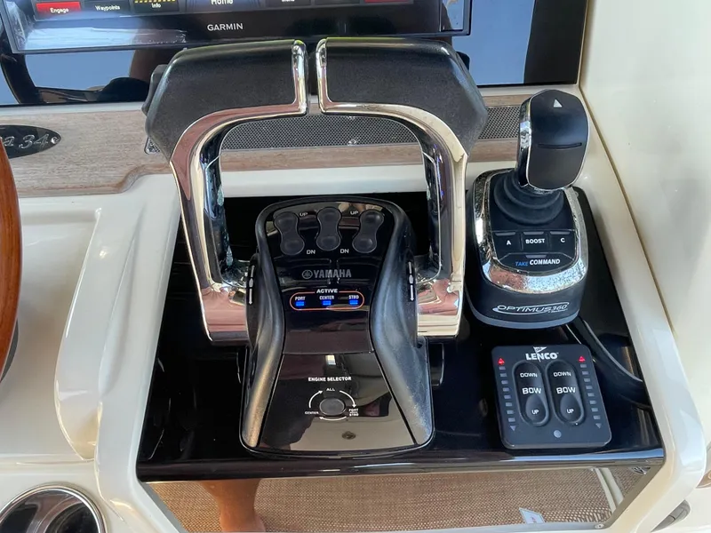 Slide: The Image of 2019 Chris-Craft Catalina 34 control panel with Yamaha throttle and joystick. - 21