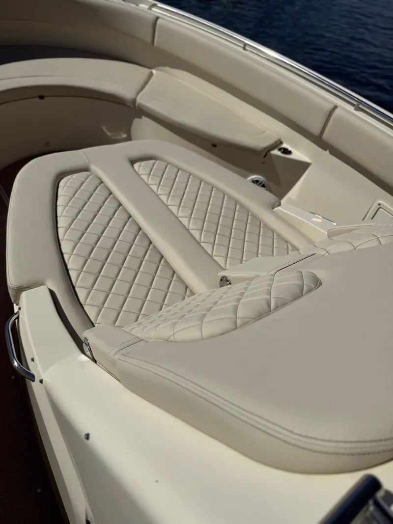 Slide: The Image of Luxurious seating on 2019 Chris-Craft Catalina 34 boat, featuring elegant quilted upholstery. - 27