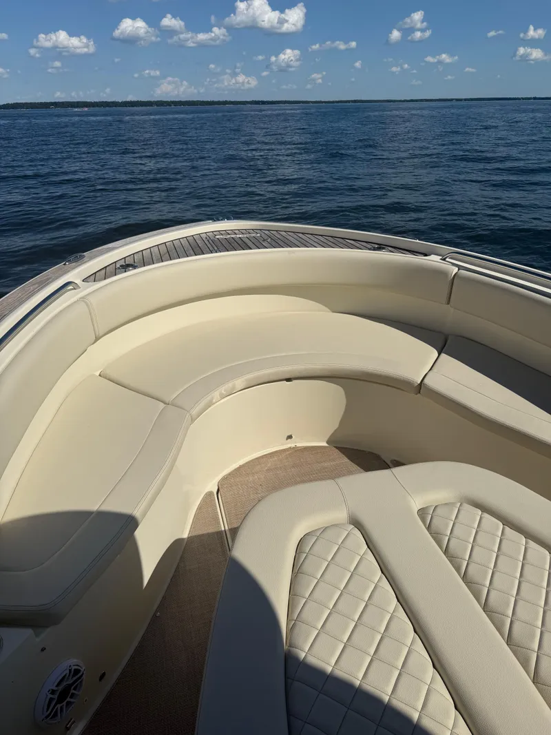 Slide: The Image of 2019 Chris-Craft Catalina 34 boat interior with beige seating on open water. - 29