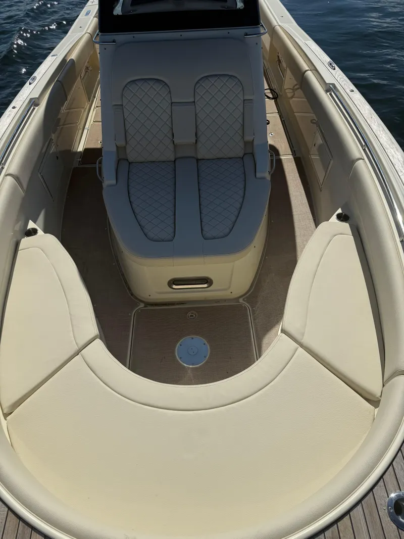 Slide: The Image of 2019 Chris-Craft Catalina 34 boat interior with beige seating and elegant design. - 30