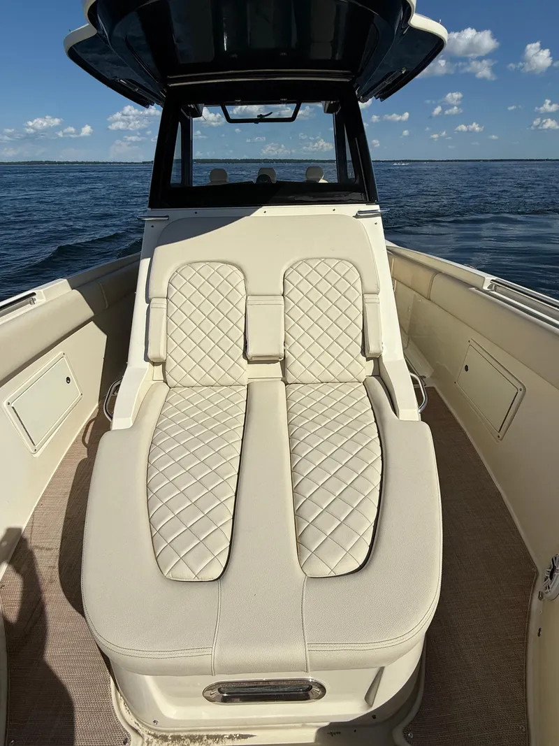 Slide: The Image of 2019 Chris-Craft Catalina 34 boat with luxurious quilted seating on open water. - 32