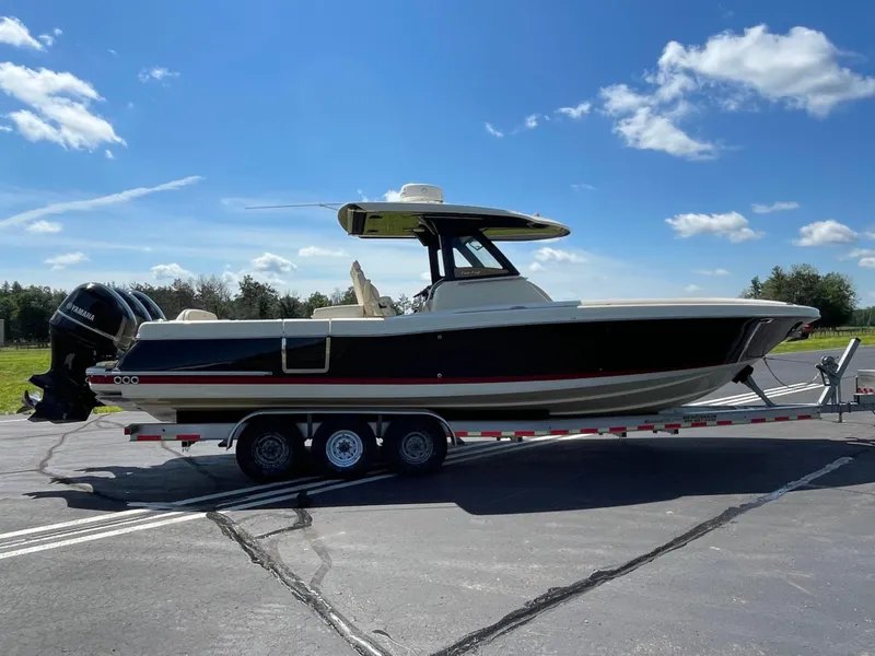 Slide: The Image of 2019 Chris-Craft Catalina 34 boat on a trailer under a clear blue sky. - 6