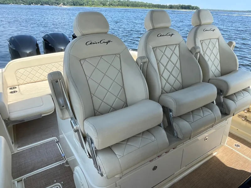 Slide: The Image of 2019 Chris-Craft Catalina 34 boat with luxurious seating and twin outboard motors. - 9