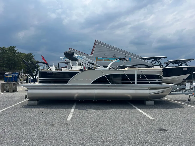The Image of 2024 Berkshire 23RFC STS 2.75 pontoon boat in a parking lot. - 0