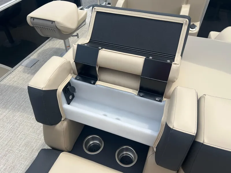 Slide: The Image of 2024 Berkshire 23RFC STS 2.75 boat interior with storage compartment and cup holders. - 12