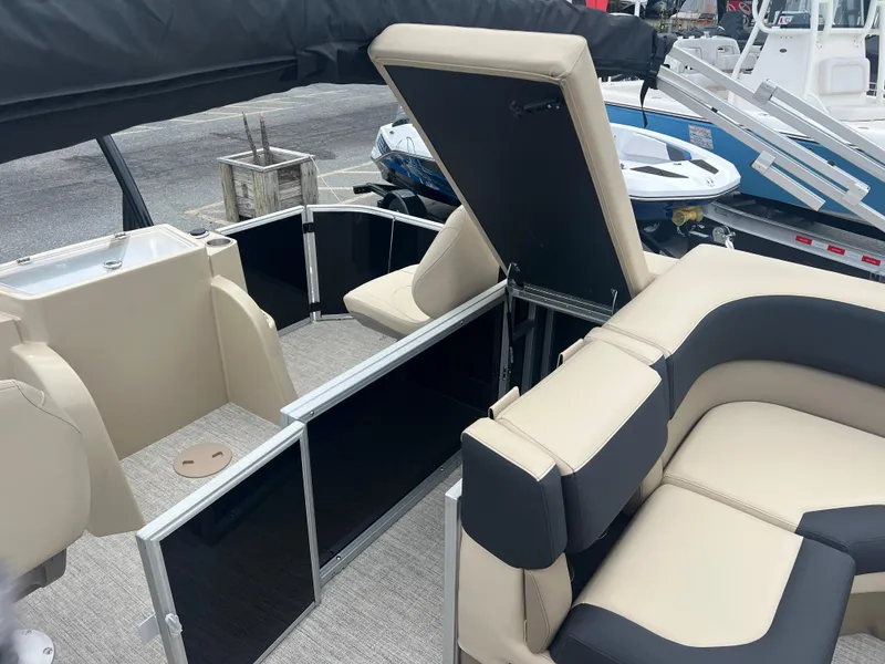 Slide: The Image of 2024 Berkshire 23RFC STS 2.75 pontoon boat interior with beige and black seating. - 17