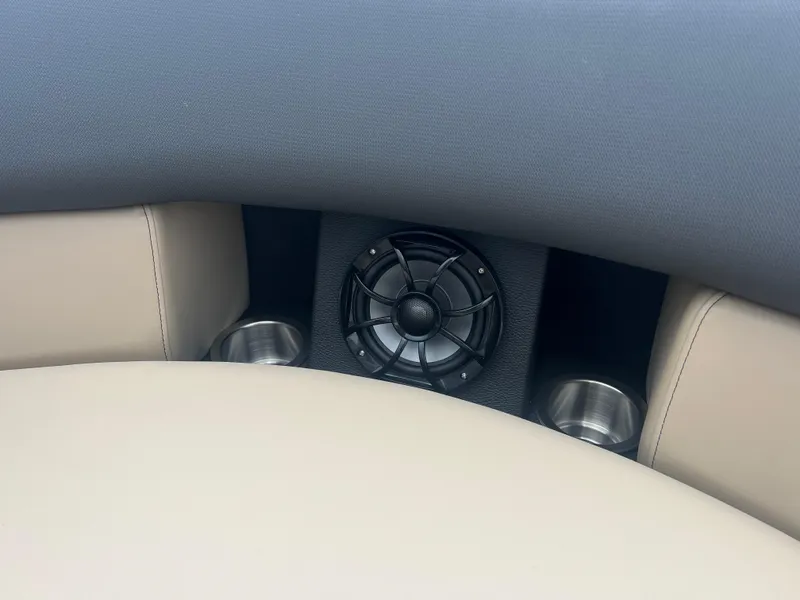 Slide: The Image of 2024 Berkshire 23RFC STS 2.75 boat interior with speaker and cup holders. - 18