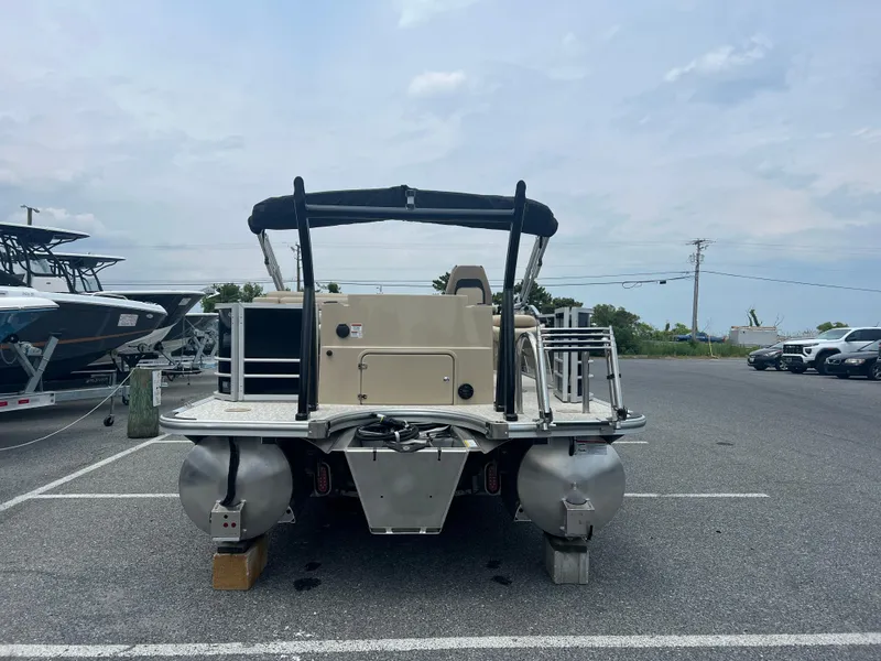 Slide: The Image of 2024 Berkshire 23RFC STS 2.75 pontoon boat in a parking lot. - 19