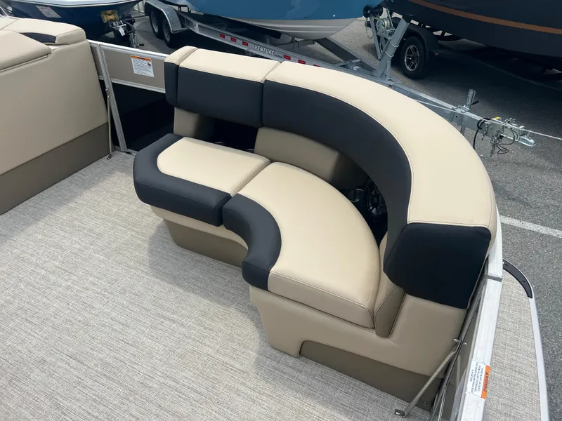 Slide: The Image of 2024 Berkshire 23RFC STS 2.75 boat with beige and black seating. - 5