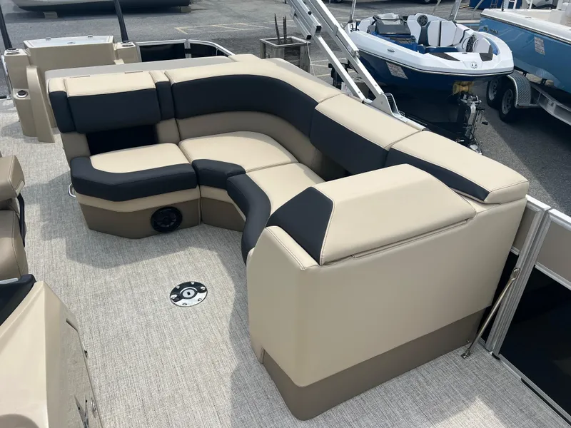 Slide: The Image of 2024 Berkshire 23RFC STS 2.75 pontoon boat with beige and black seating. - 7