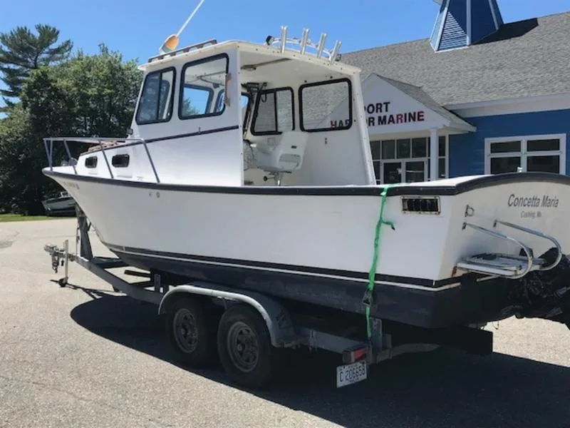 Slide: The Image of 2003 Eastern 27' Lobster boat on trailer at a marine service center. - 11