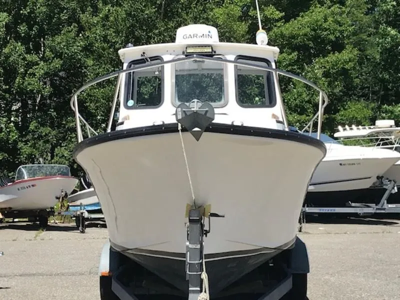 Slide: The Image of 2003 Eastern 27' Lobster boat on trailer, front view, with Garmin equipment. - 17