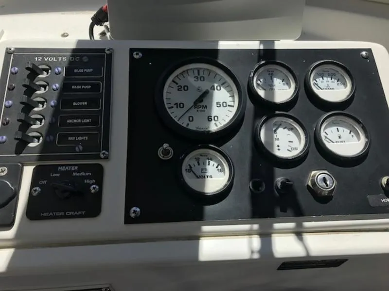 Slide: The Image of Control panel of a 2003 Eastern 27' Lobster boat with gauges and switches. - 9