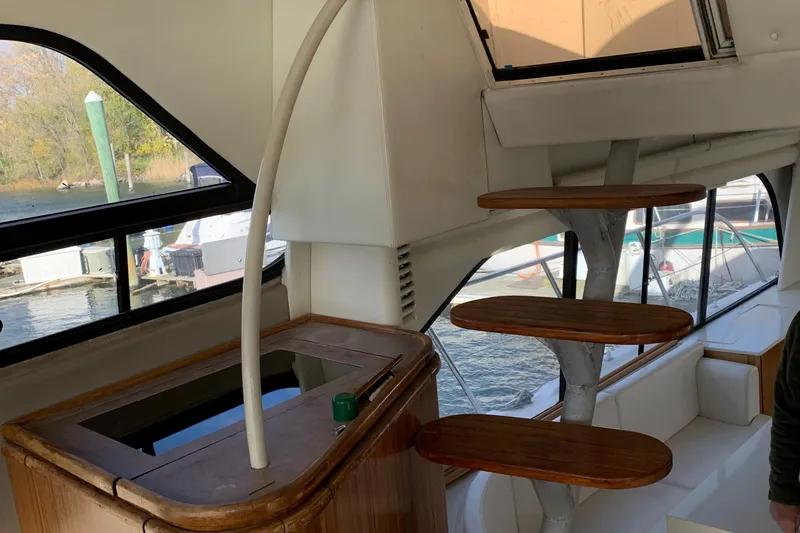Slide: The Image of Interior of 1999 Bayliner 5788 Pilot House Motoryacht with spiral staircase and large windows. - 13