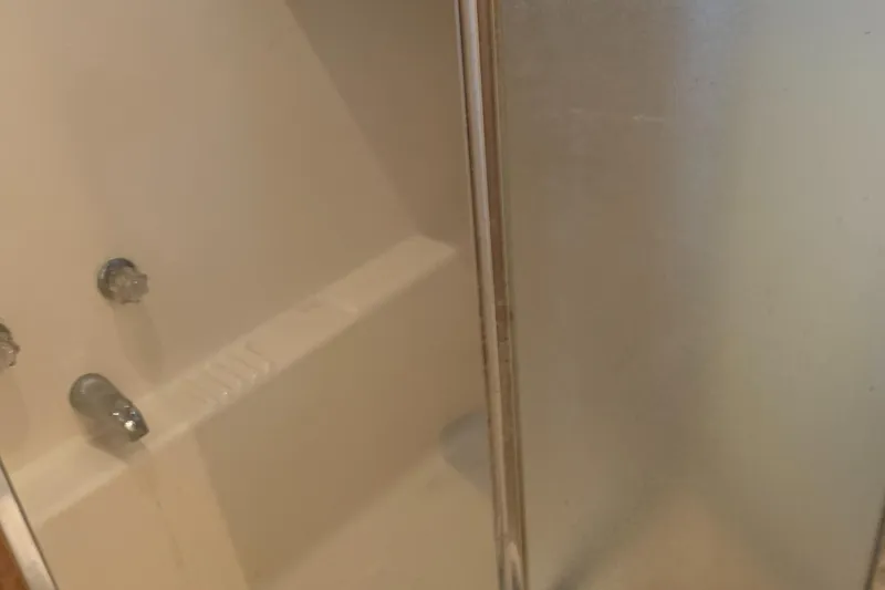 Slide: The Image of Shower area in 1999 Bayliner 5788 Pilot House Motoryacht with glass door. - 39