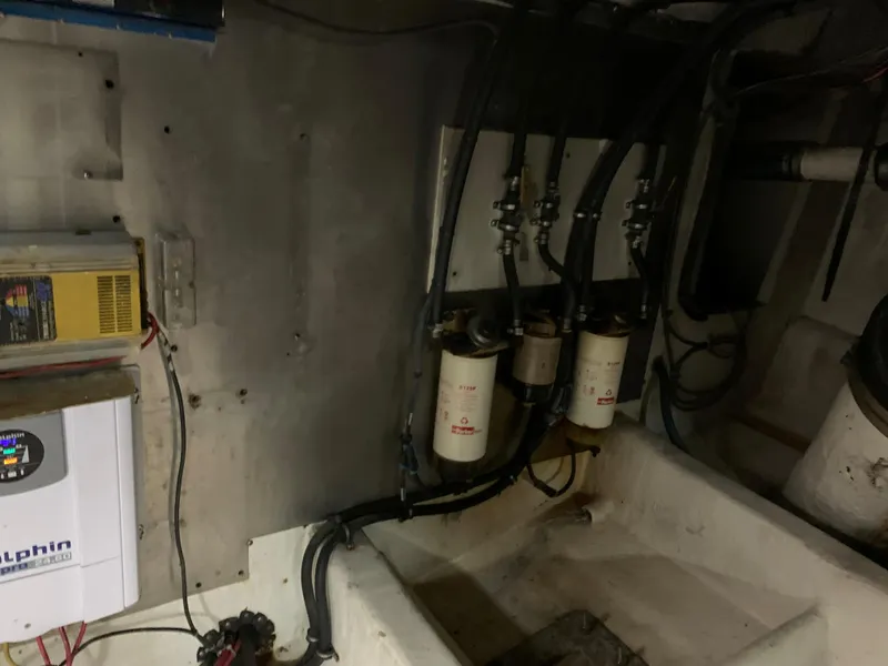 Slide: The Image of Engine room of 1999 Bayliner 5788 Pilot House Motoryacht with fuel filters and electrical components. - 47