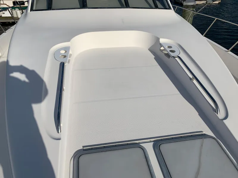 Slide: The Image of 1999 Bayliner 5788 Pilot House Motoryacht deck with stainless steel railings and hatches. - 5