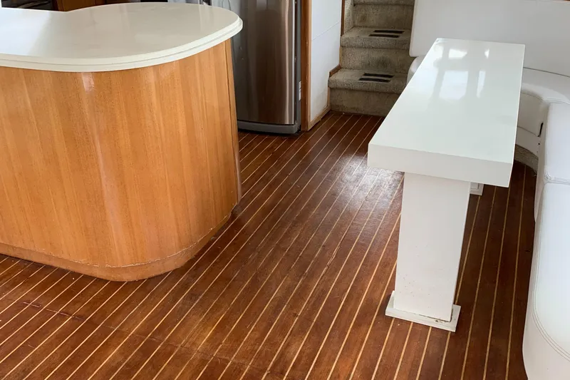 Slide: The Image of Interior of 1999 Bayliner 5788 Pilot House Motoryacht with wooden flooring and modern furnishings. - 6