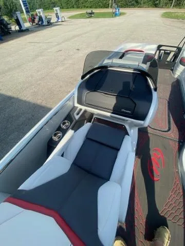 Slide: The Image of 2024 Manitou XT RFXW SHP boat interior with sleek seating and modern design. - 2