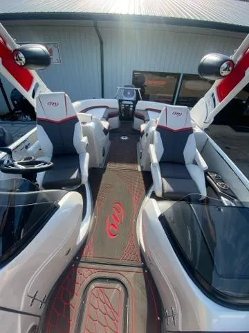 Slide: The Image of 2024 Manitou XT RFXW SHP boat interior with modern seating and sleek design. - 5