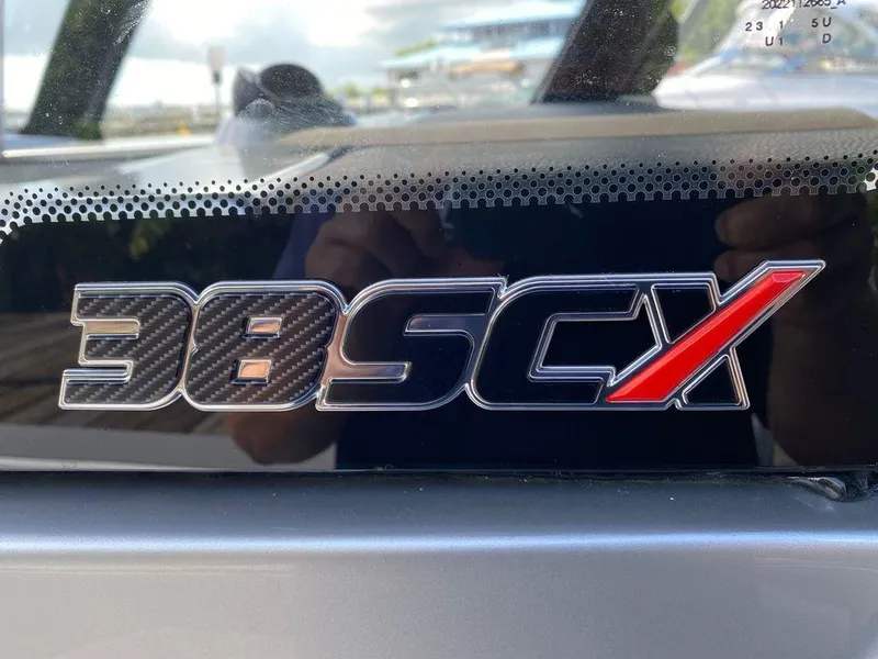 Slide: The Image of 2025 Fountain 38 SCX boat on water, showcasing sleek design and modern seating. - 1