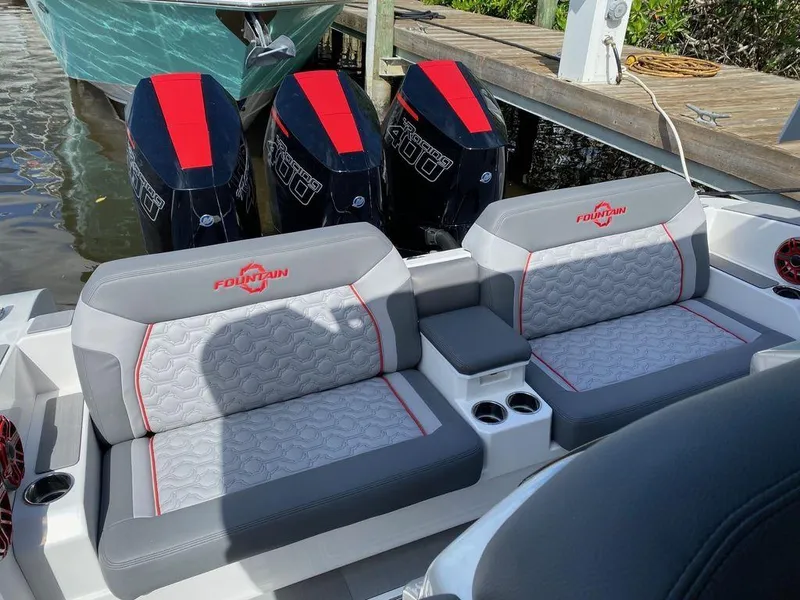 Slide: The Image of 2025 Fountain 38 SCX boat with four red marine speakers on a white panel. - 13