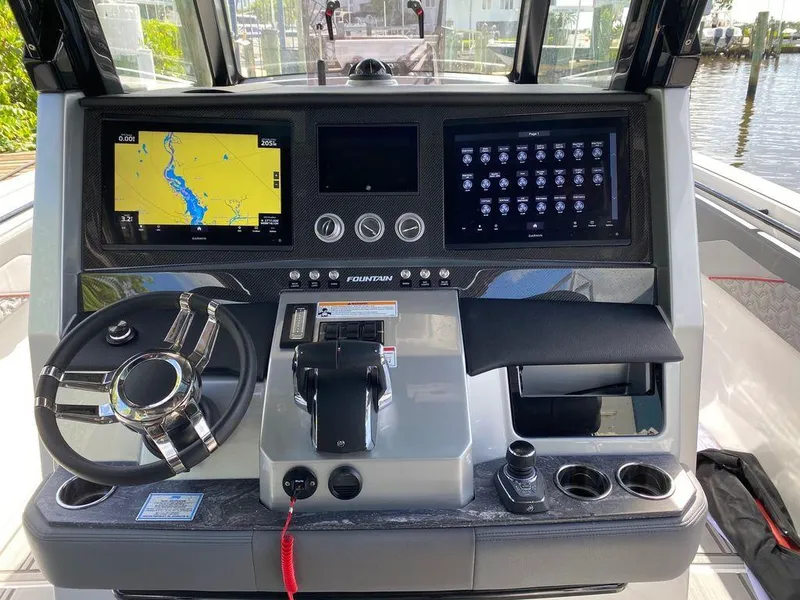 Slide: The Image of 2025 Fountain 38 SCX boat interior with red speakers and sleek seating design. - 18