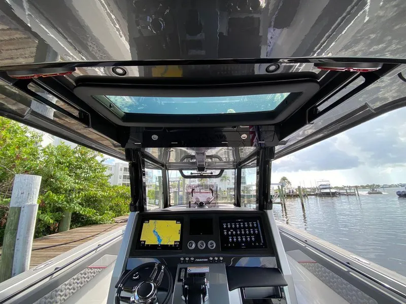 Slide: The Image of 2025 Fountain 38 SCX boat interior with sleek design and red accents. - 19