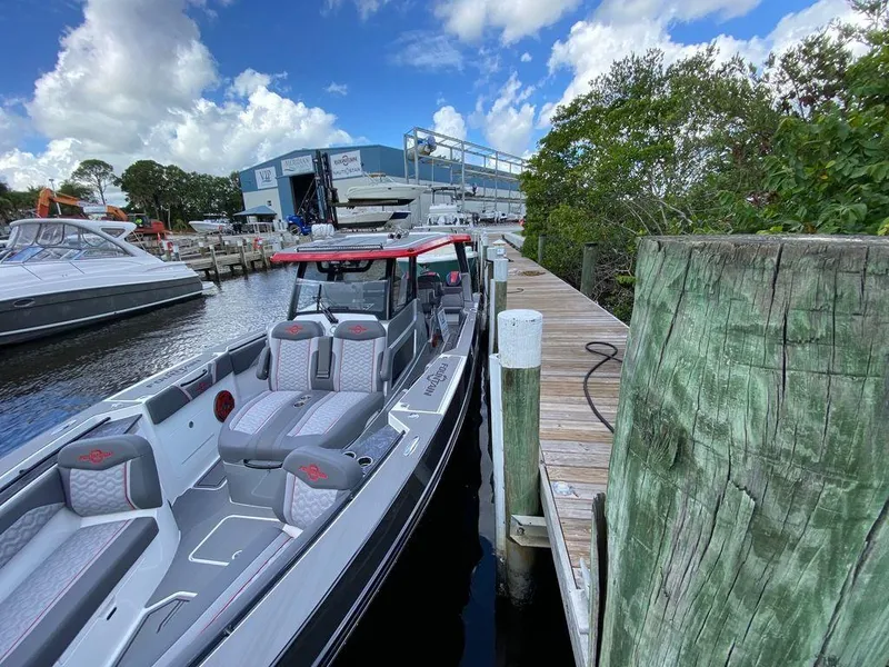Slide: The Image of Interior view of 2025 Fountain 38 SCX boat, featuring sleek seating and red speakers. - 20